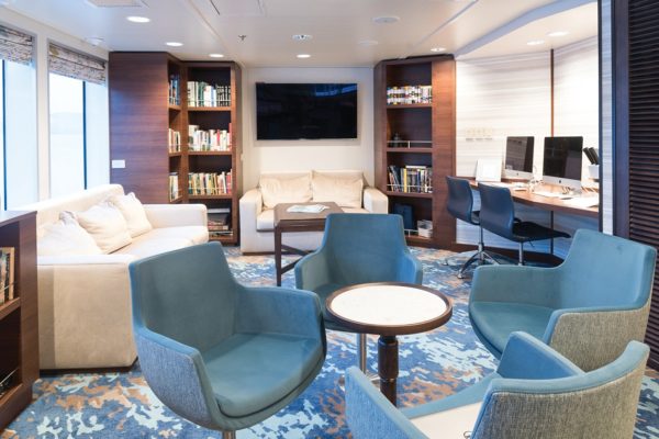 Sustainable carpet solution for the library and photo kiosk aboard the cruise ship National Geographic Quest, delivered by Dansk Wilton