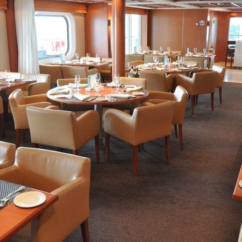 Unique carpet solutions for the restaurant at the cruise ship Seabourn Sojourn, delivered by Dansk Wilton