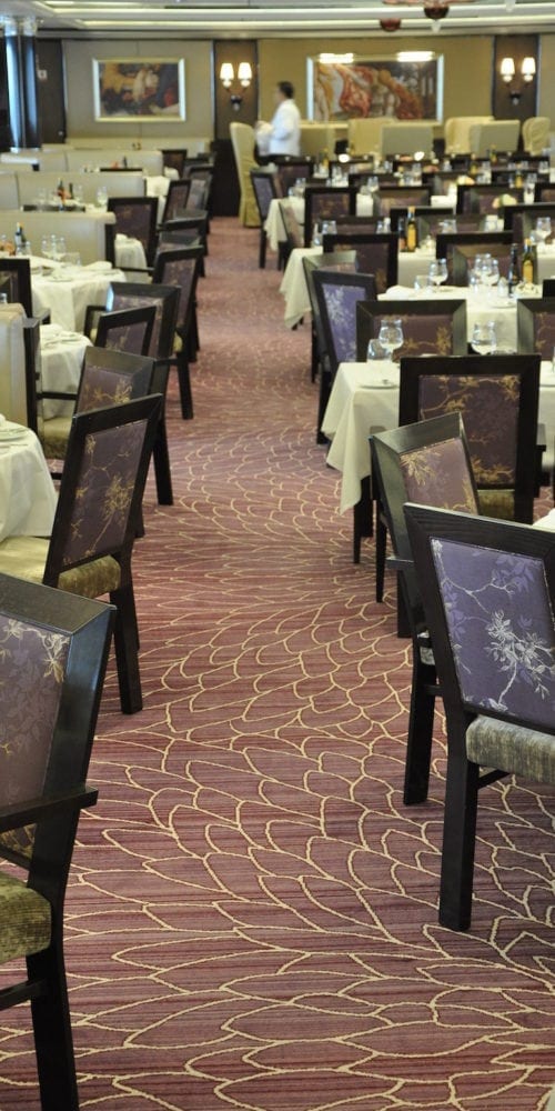 Beautiful carpet solutions for the restaurant at hotel Costa Neoromantica, delivered by Dansk Wilton